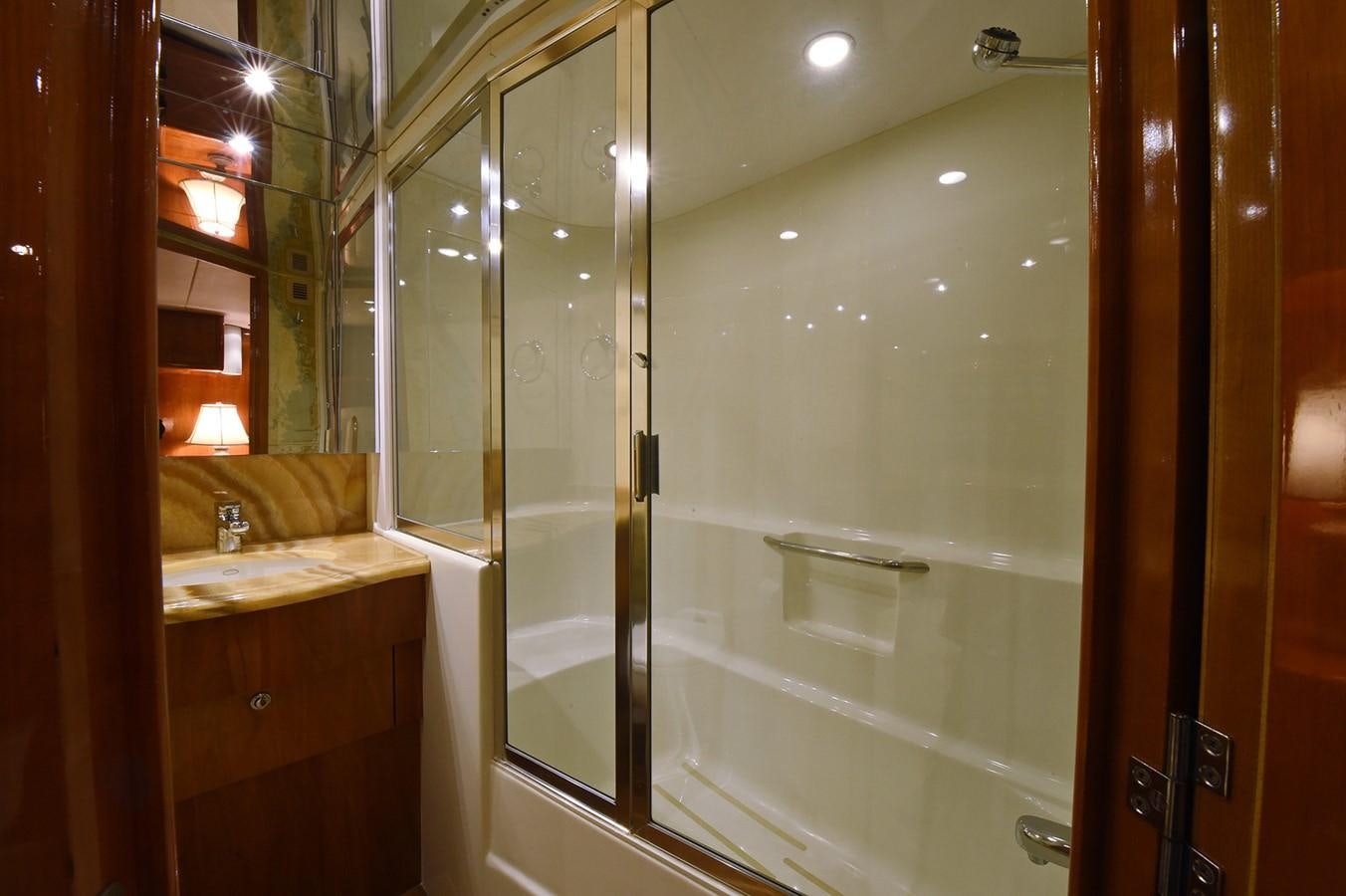 a bathroom with a glass shower aboard AMORE MIO 1 Yacht for Sale
