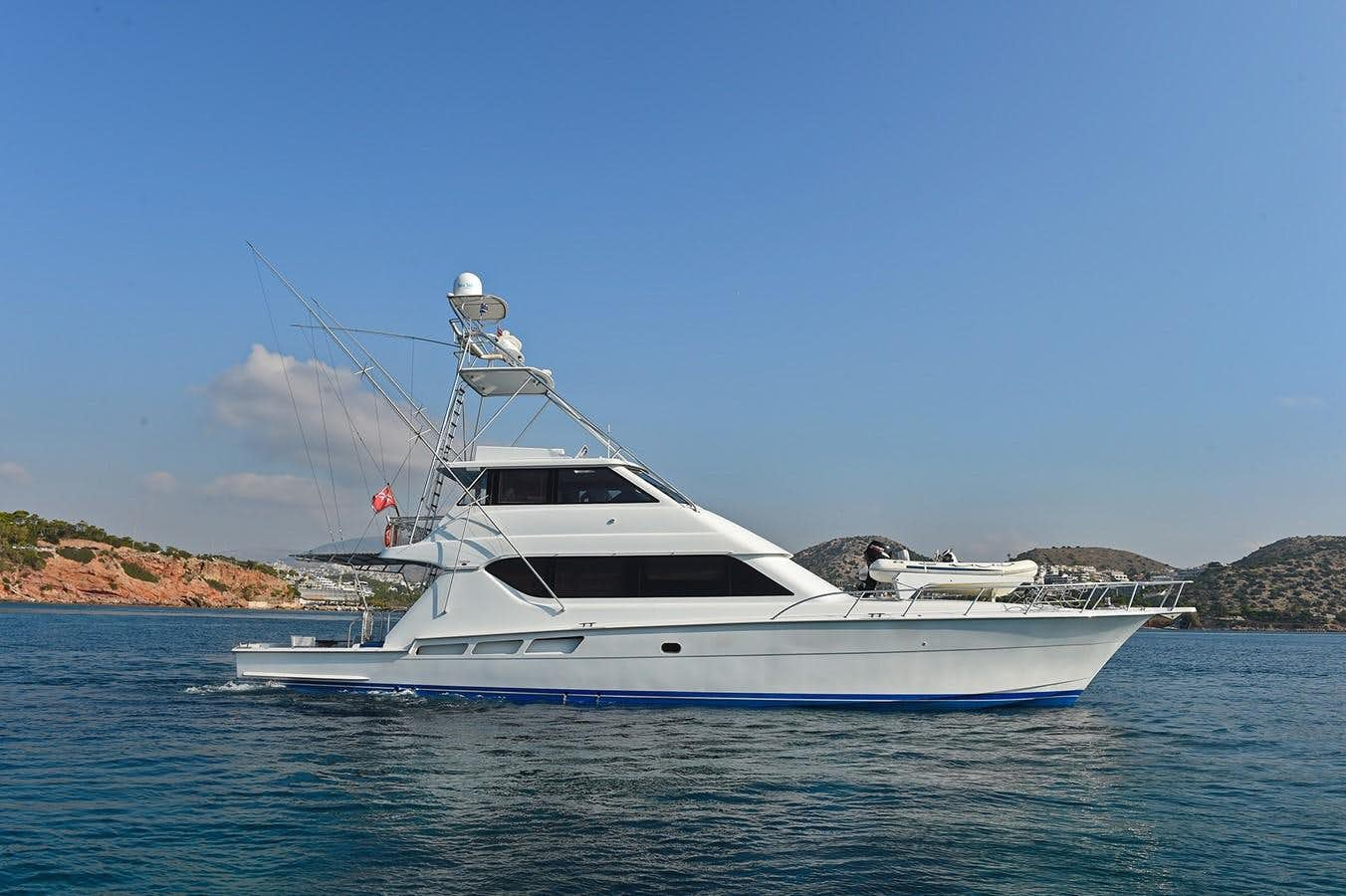 a white yacht on the water aboard AMORE MIO 1 Yacht for Sale