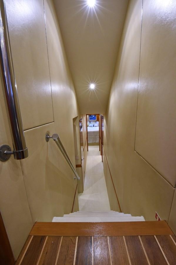 a hallway with a door and a mirror aboard AMORE MIO 1 Yacht for Sale