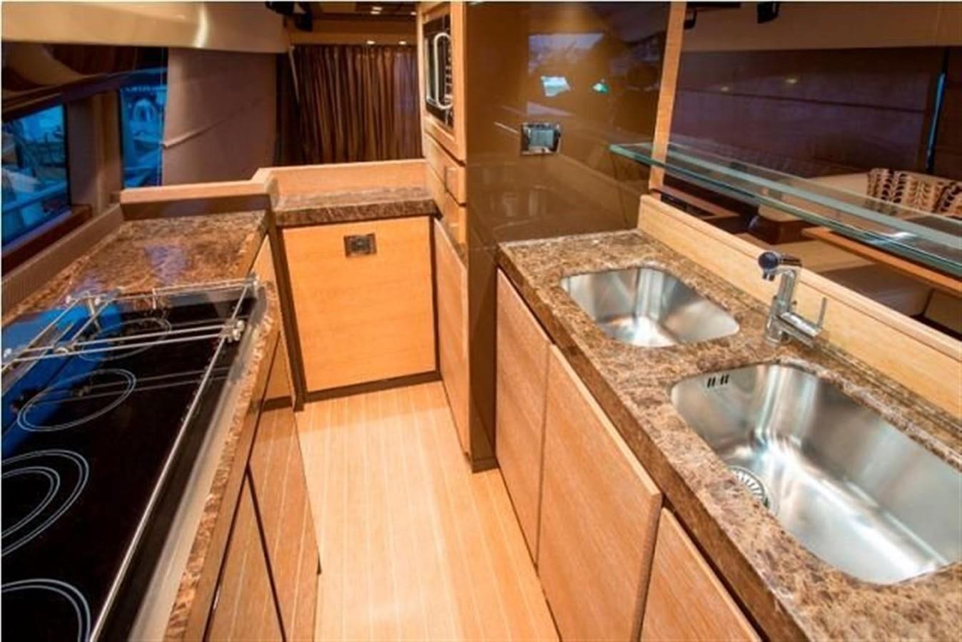 a kitchen with a sink and a microwave aboard RAMAYA Yacht for Sale