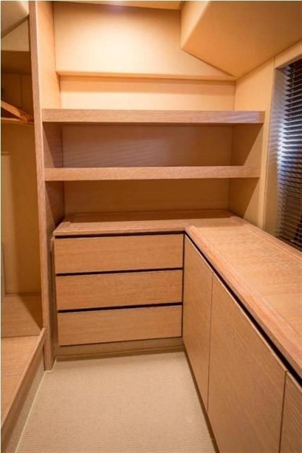 a wooden cabinet with drawers aboard RAMAYA Yacht for Sale