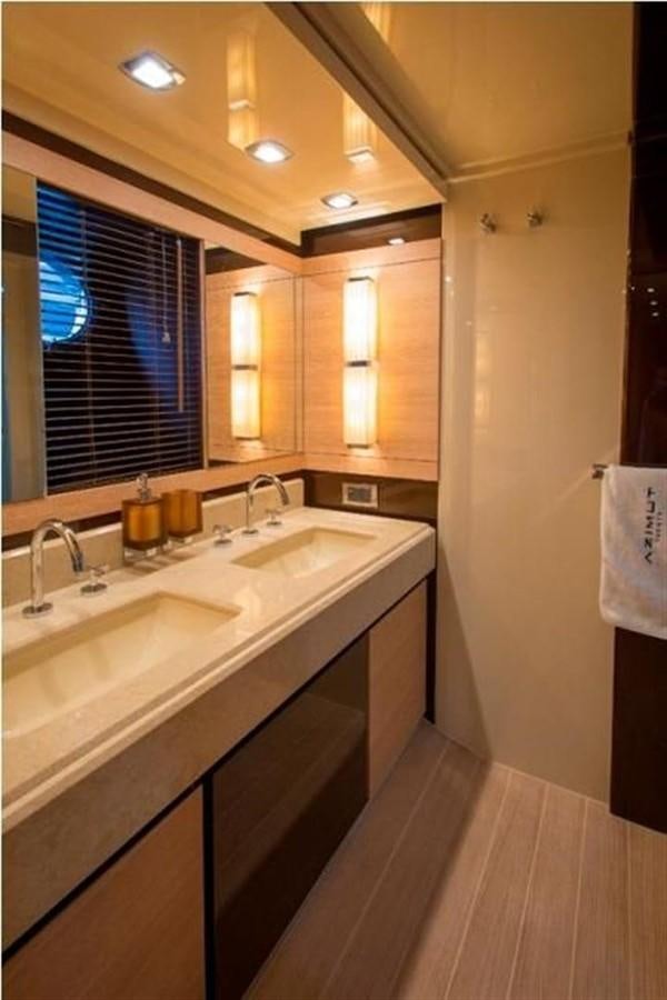 a bathroom with a sink and a window aboard RAMAYA Yacht for Sale