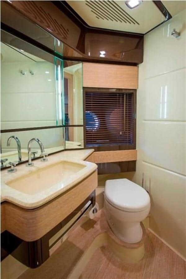 a bathroom with a toilet and a sink aboard RAMAYA Yacht for Sale