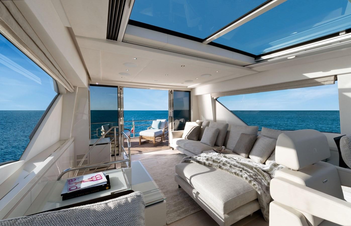 a living room with a large window aboard MCY 70 SKYLOUNGE  Yacht for Sale