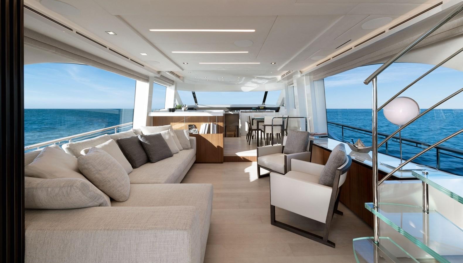 a living room with a large window aboard MCY 70 SKYLOUNGE  Yacht for Sale