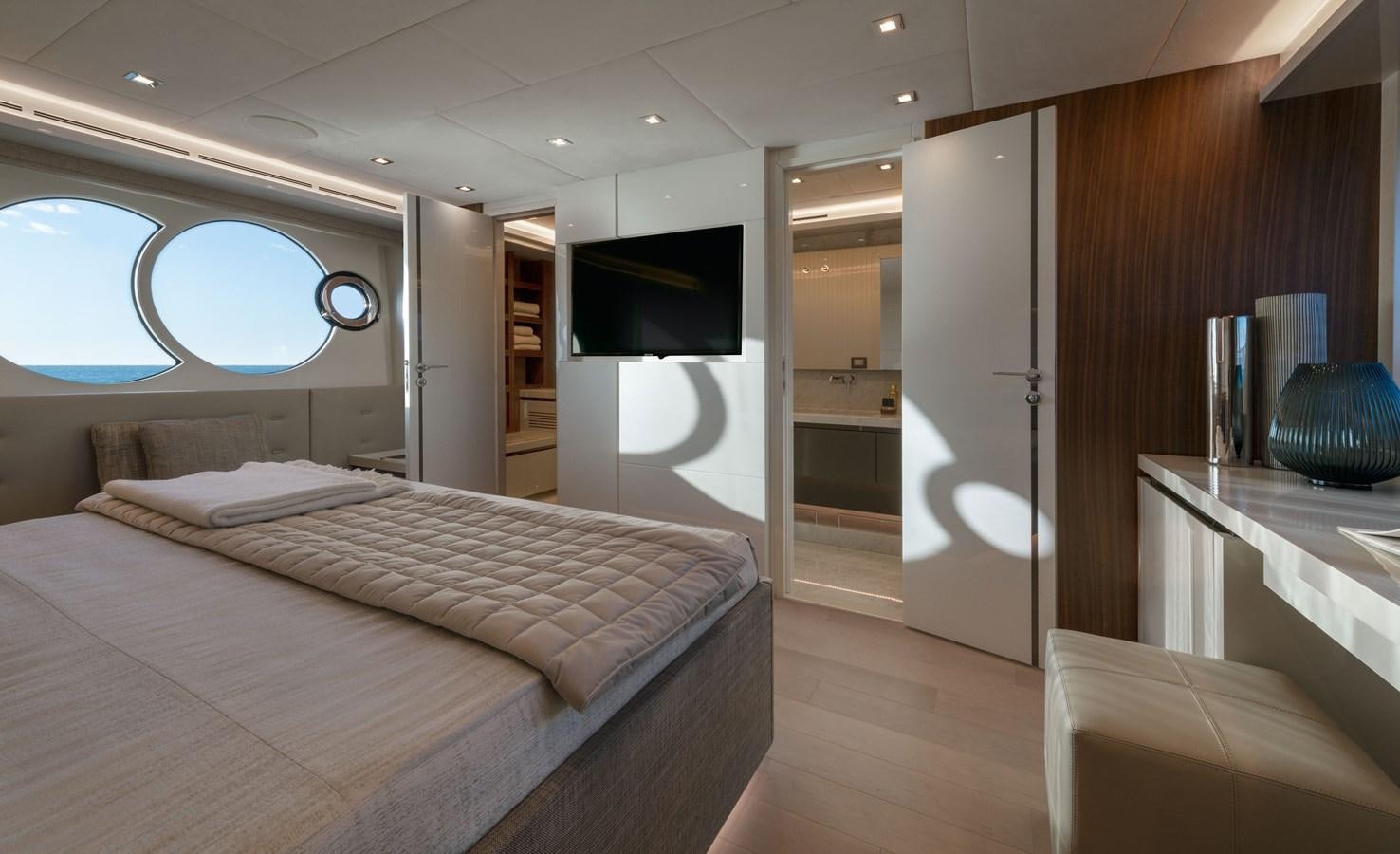 a room with a bed and a tv aboard MCY 70 SKYLOUNGE  Yacht for Sale