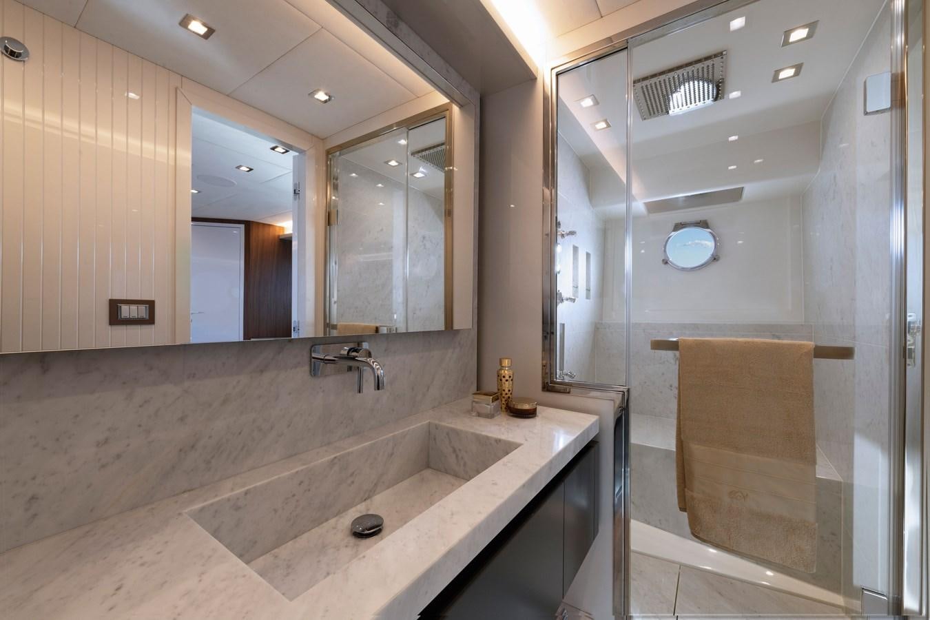 a bathroom with a large mirror aboard MCY 70 SKYLOUNGE  Yacht for Sale