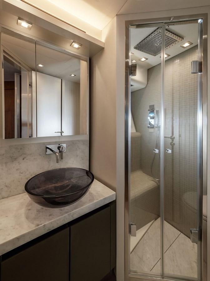 a bathroom with a sink and a mirror aboard MCY 70 SKYLOUNGE  Yacht for Sale