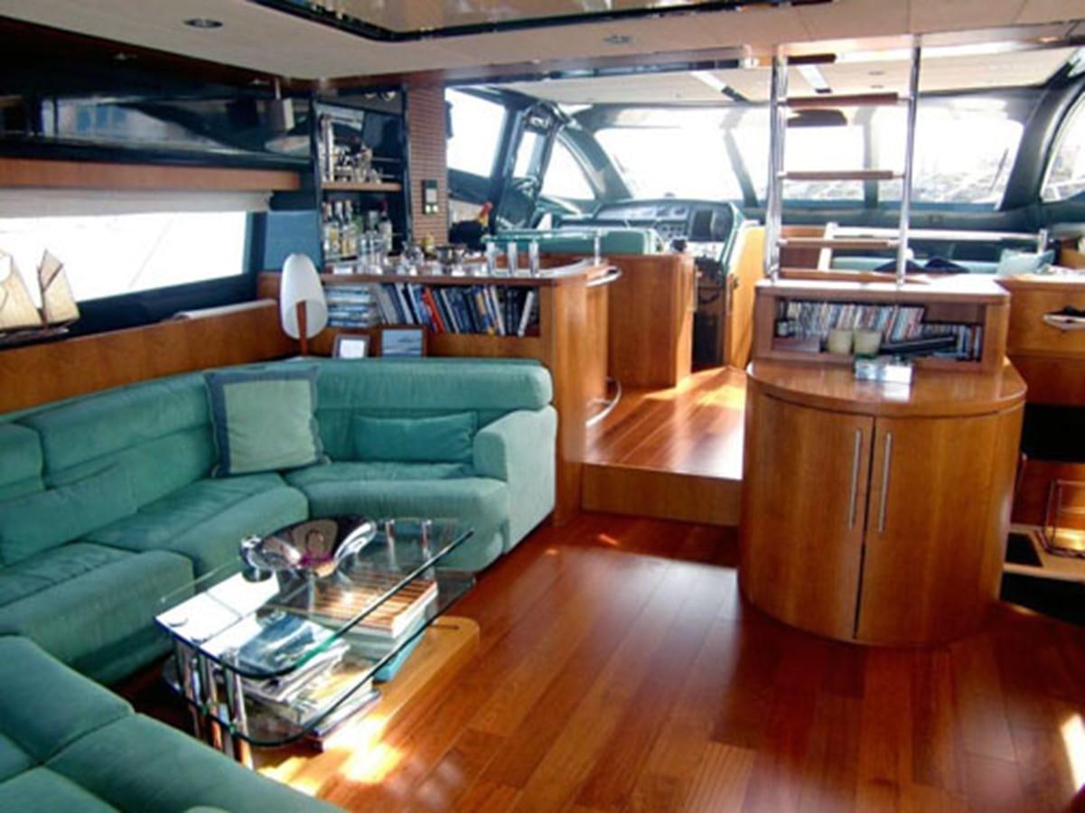 a room with a couch and a table aboard MACAMI Yacht for Sale