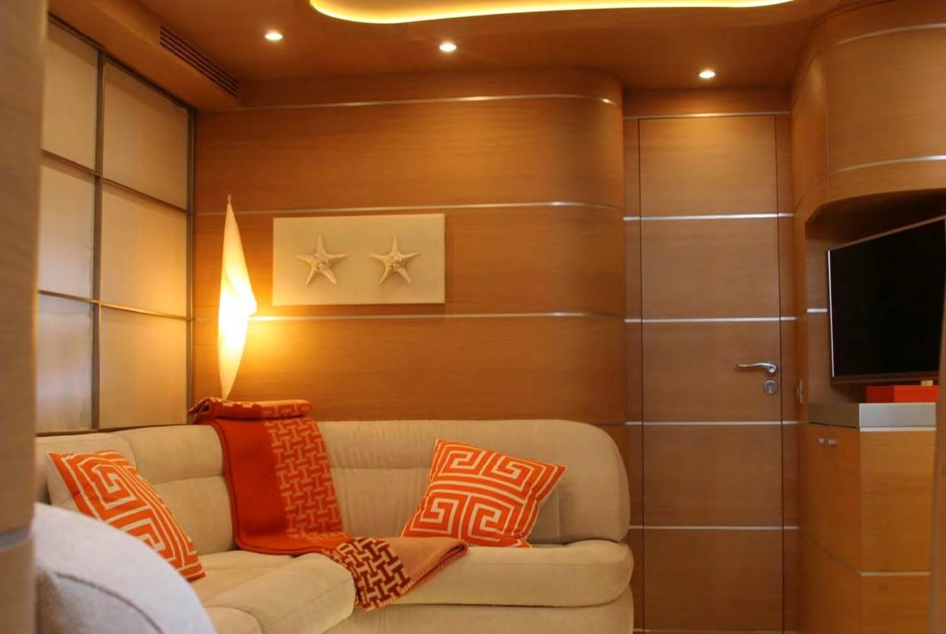 a room with a bed and a television aboard FOX Yacht for Sale