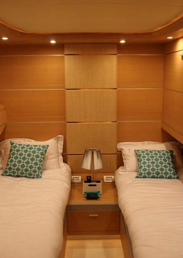 a hotel room with two beds aboard FOX Yacht for Sale