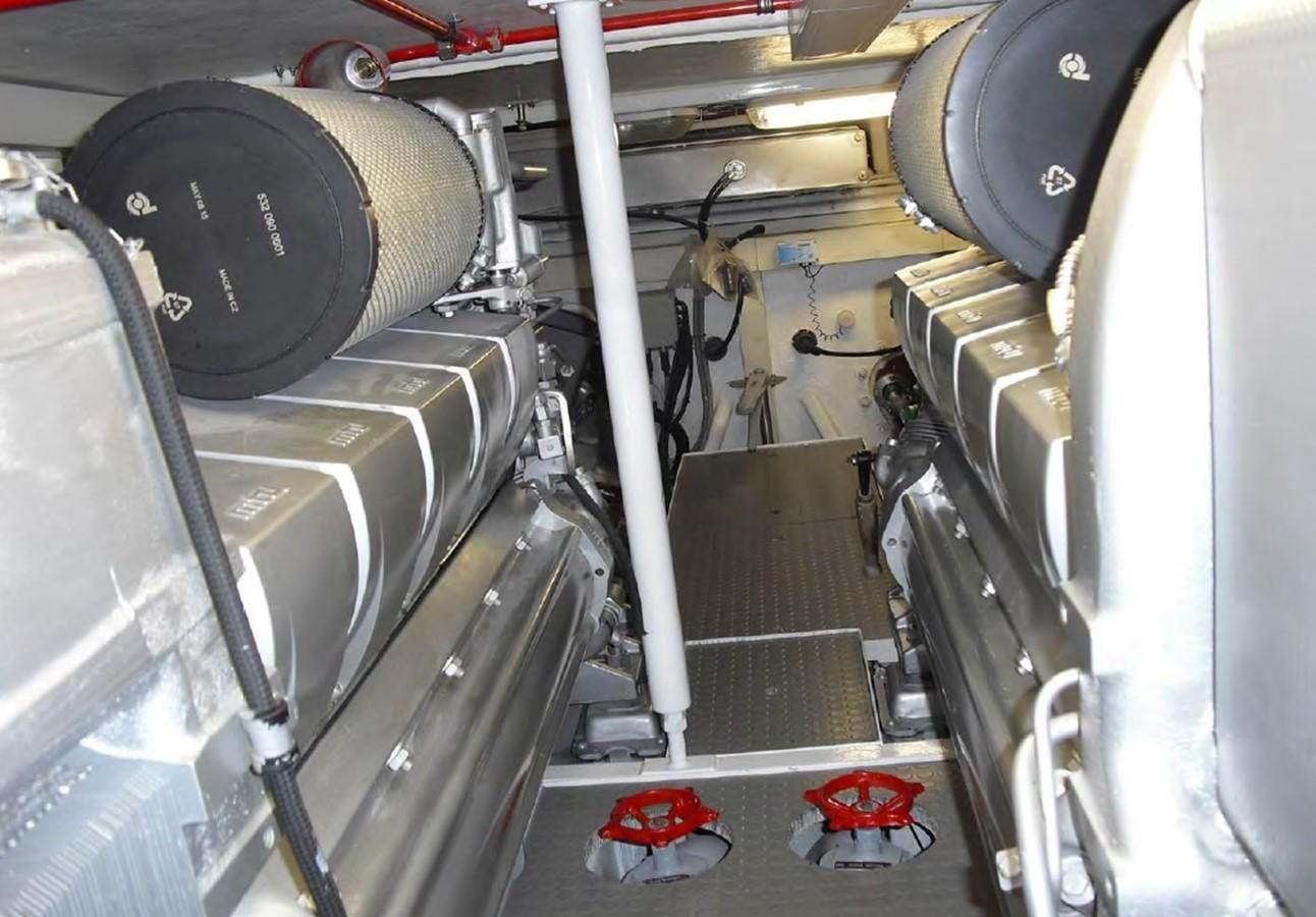 a large machine with a large metal cylinder aboard FOX Yacht for Sale