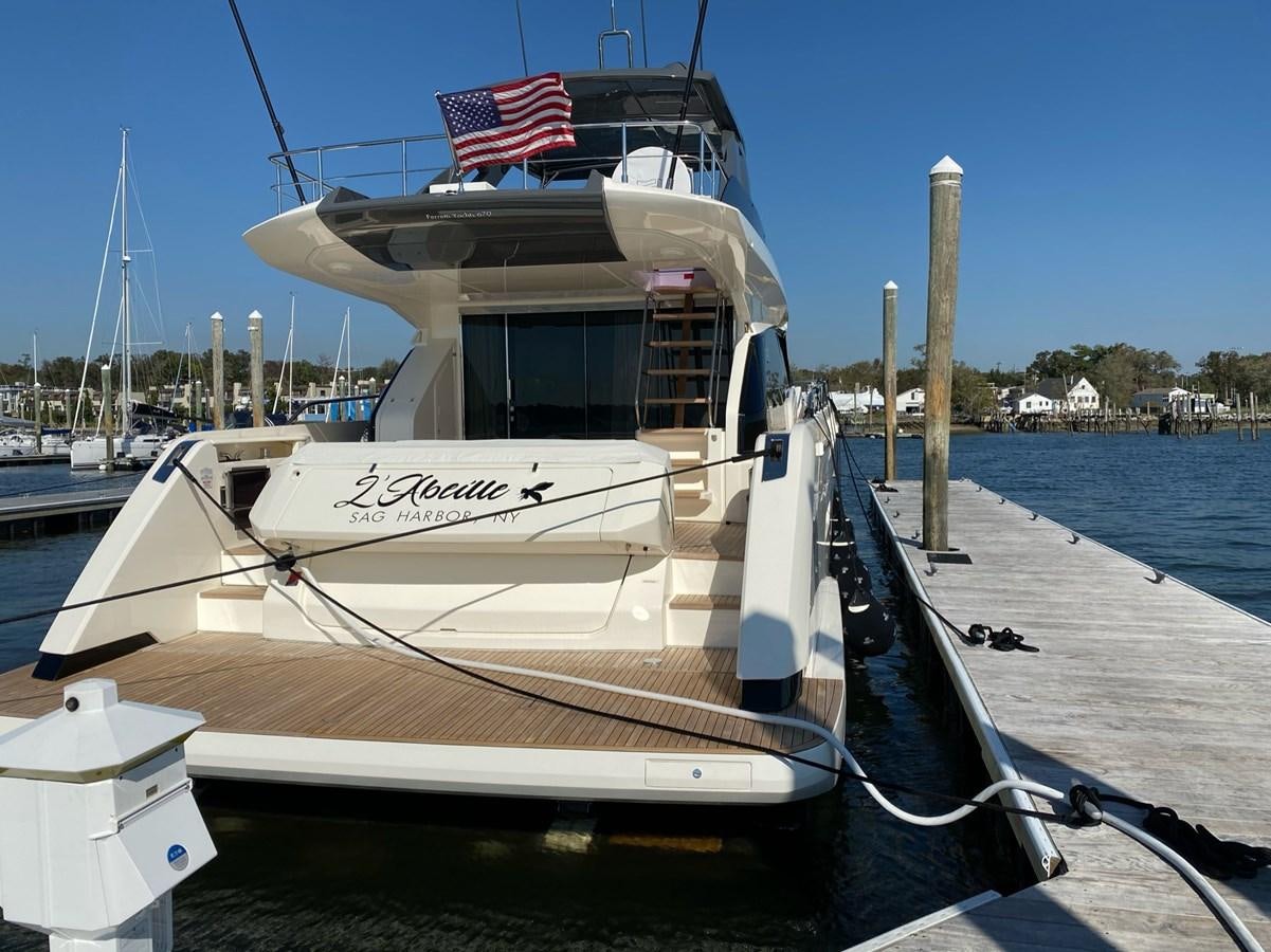 a boat docked at a pier aboard L’ABEILLE Yacht for Sale