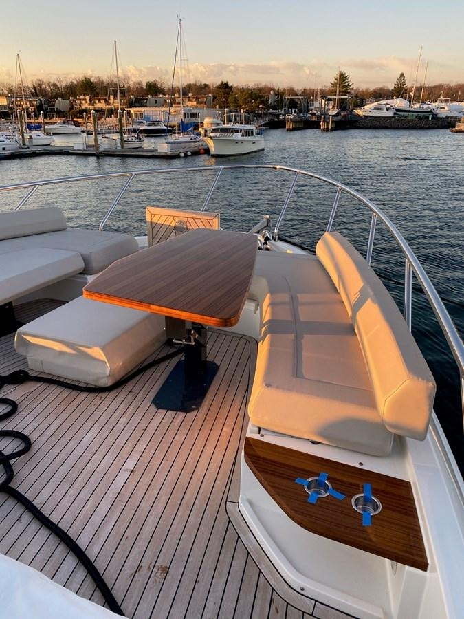 a boat is parked on the side of a lake aboard L’ABEILLE Yacht for Sale