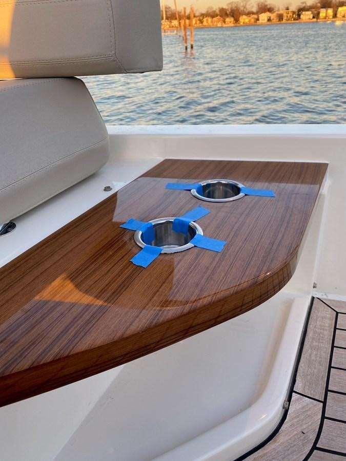 a table with a blue object on it aboard L’ABEILLE Yacht for Sale