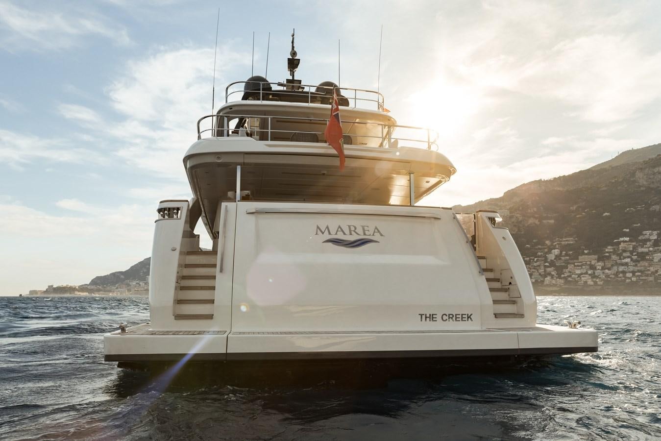 a white boat on the water aboard EROS Yacht for Sale