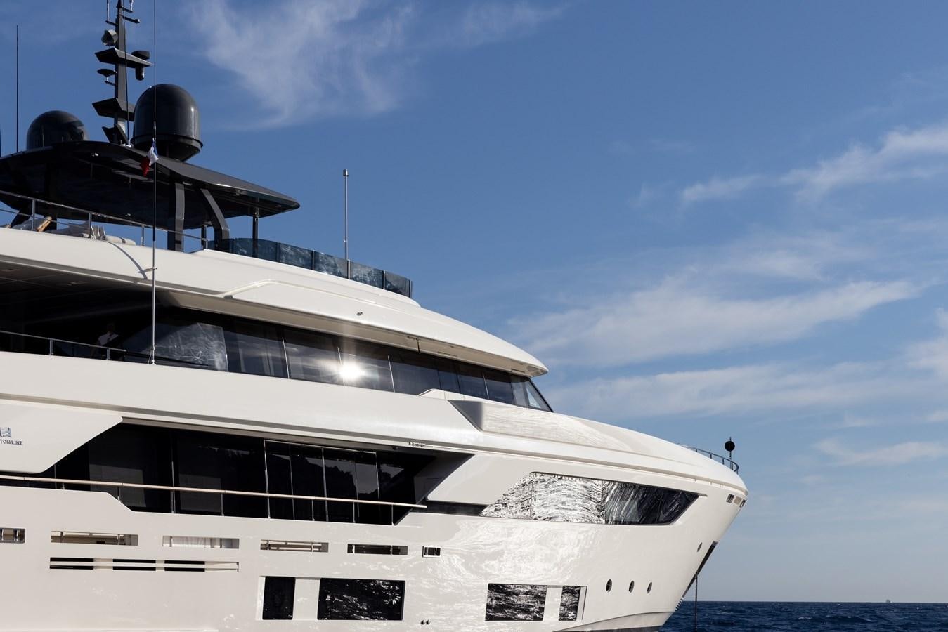 a white boat with a black top aboard EROS Yacht for Sale