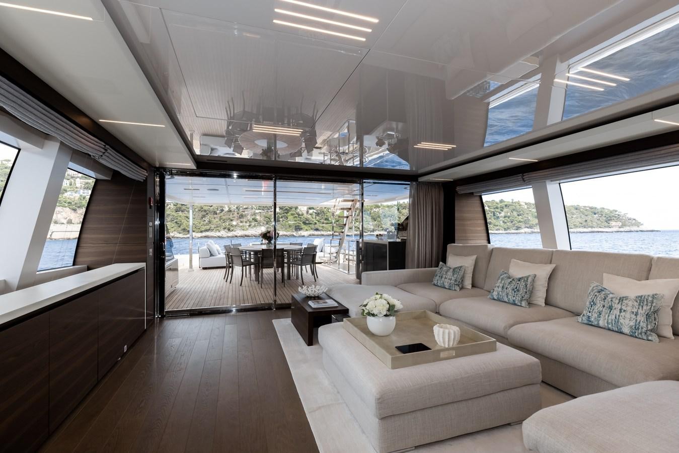 a living room with a large window aboard EROS Yacht for Sale