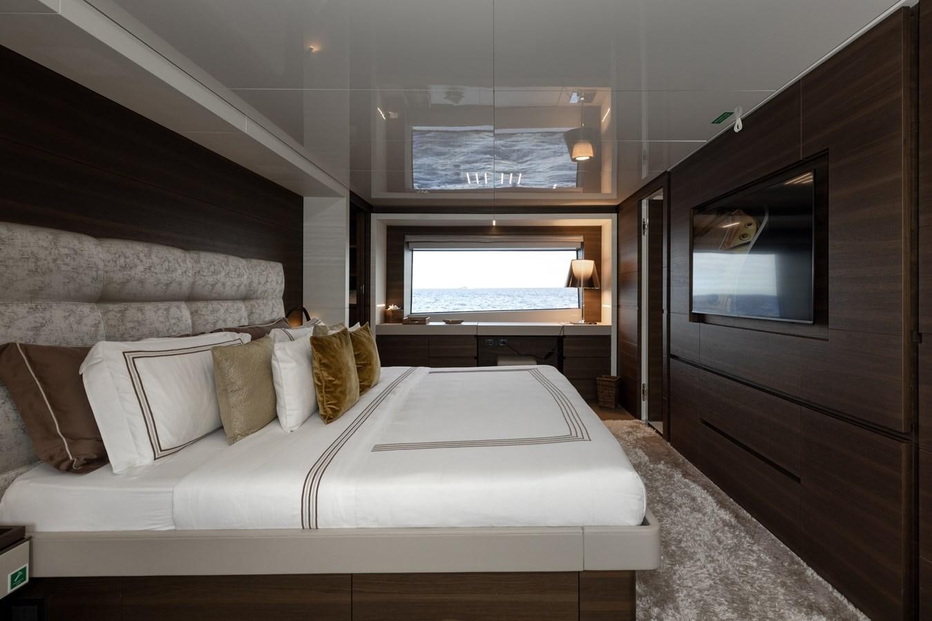 a bed in a room aboard EROS Yacht for Sale