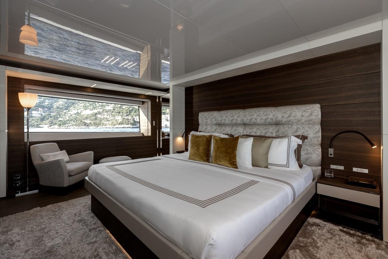 a bed in a room aboard EROS Yacht for Sale