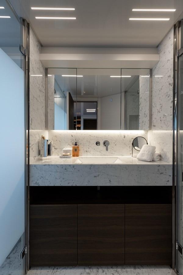 a bathroom with a large mirror aboard EROS Yacht for Sale