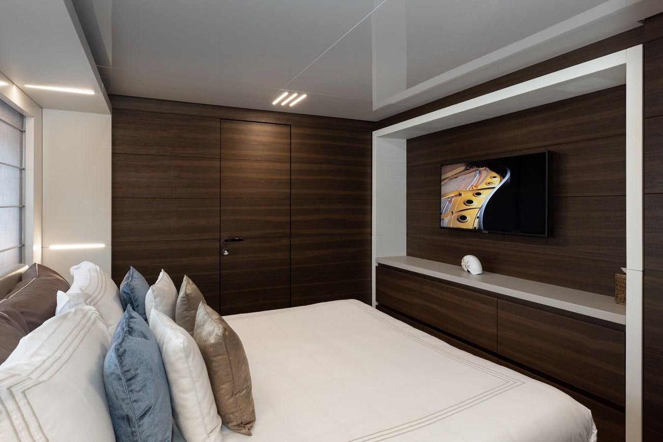 a bed in a room aboard EROS Yacht for Sale