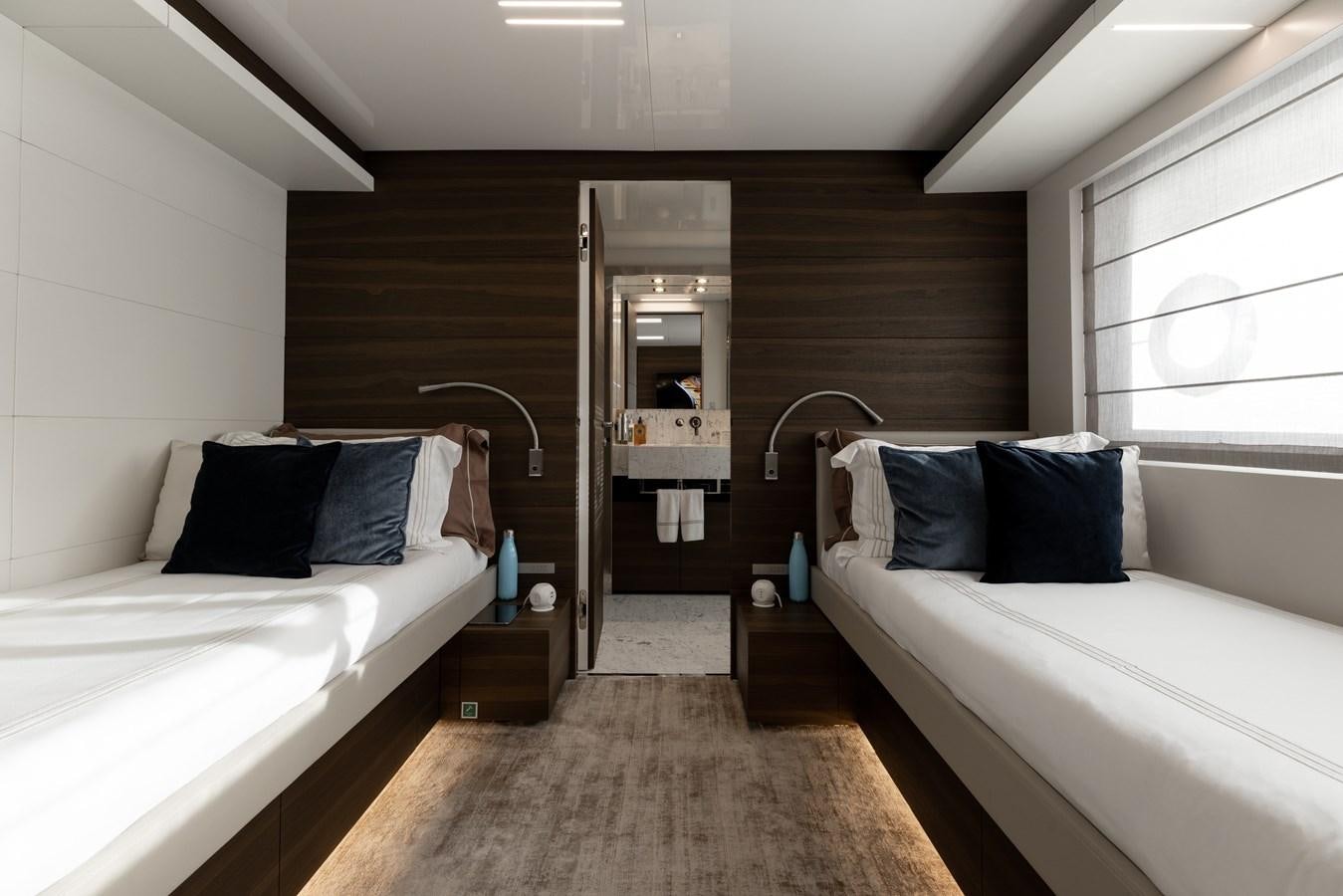 a couple of beds in a room aboard EROS Yacht for Sale