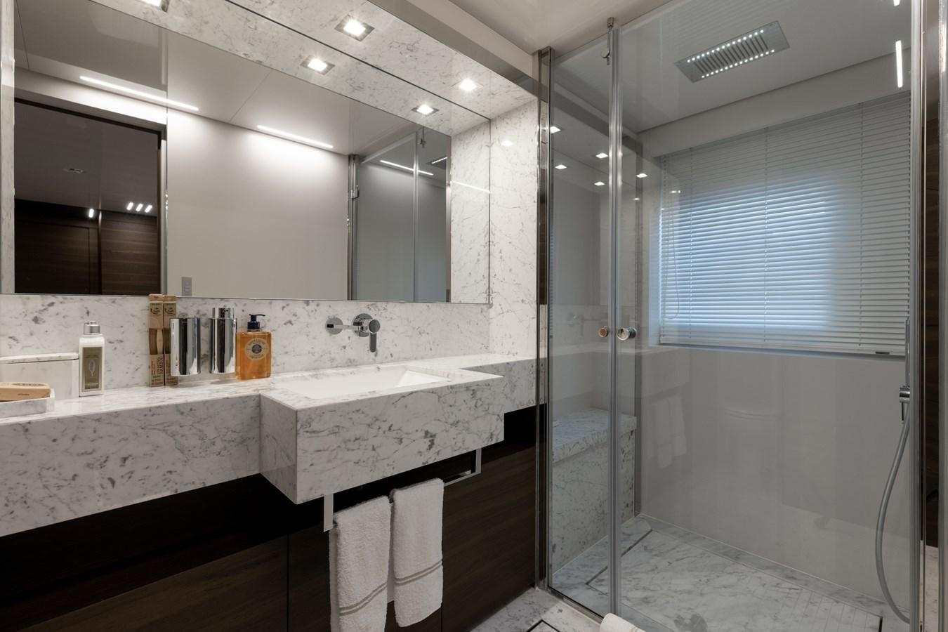 a bathroom with a large mirror aboard EROS Yacht for Sale