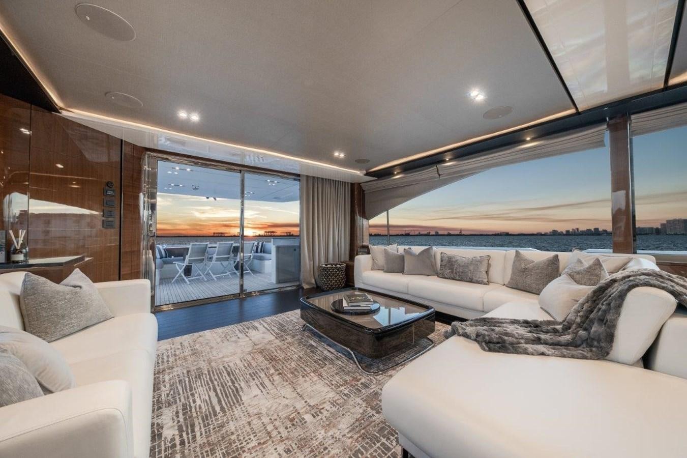 a living room with a large glass door aboard PRONTO Yacht for Sale