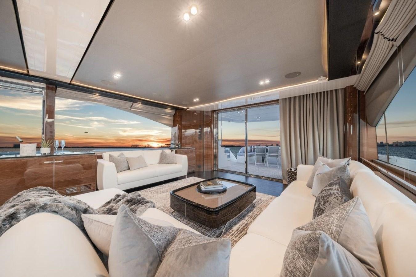 a living room with a large window aboard PRONTO Yacht for Sale