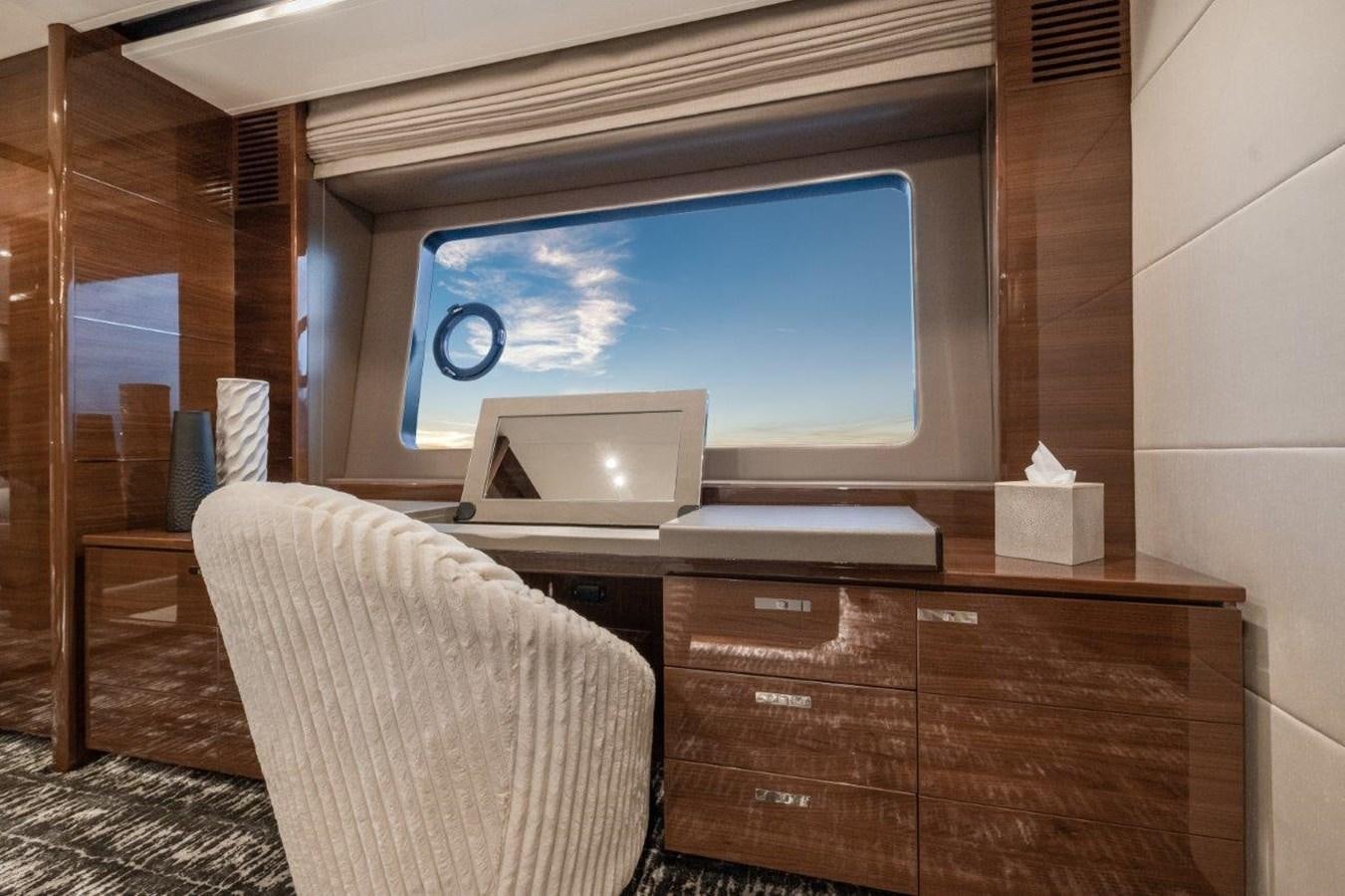 a room with a tv and a dresser aboard PRONTO Yacht for Sale