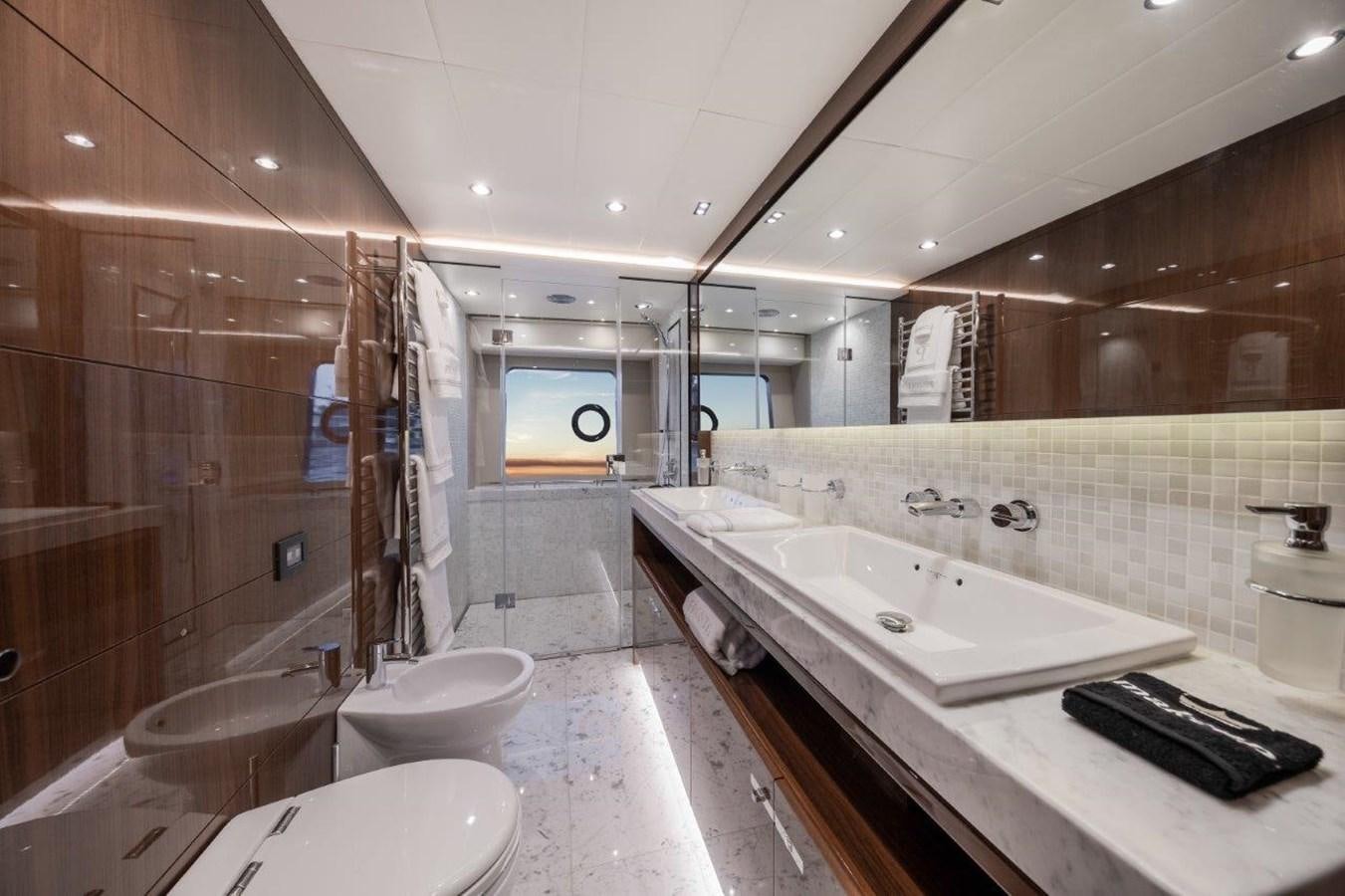 a bathroom with a large mirror aboard PRONTO Yacht for Sale