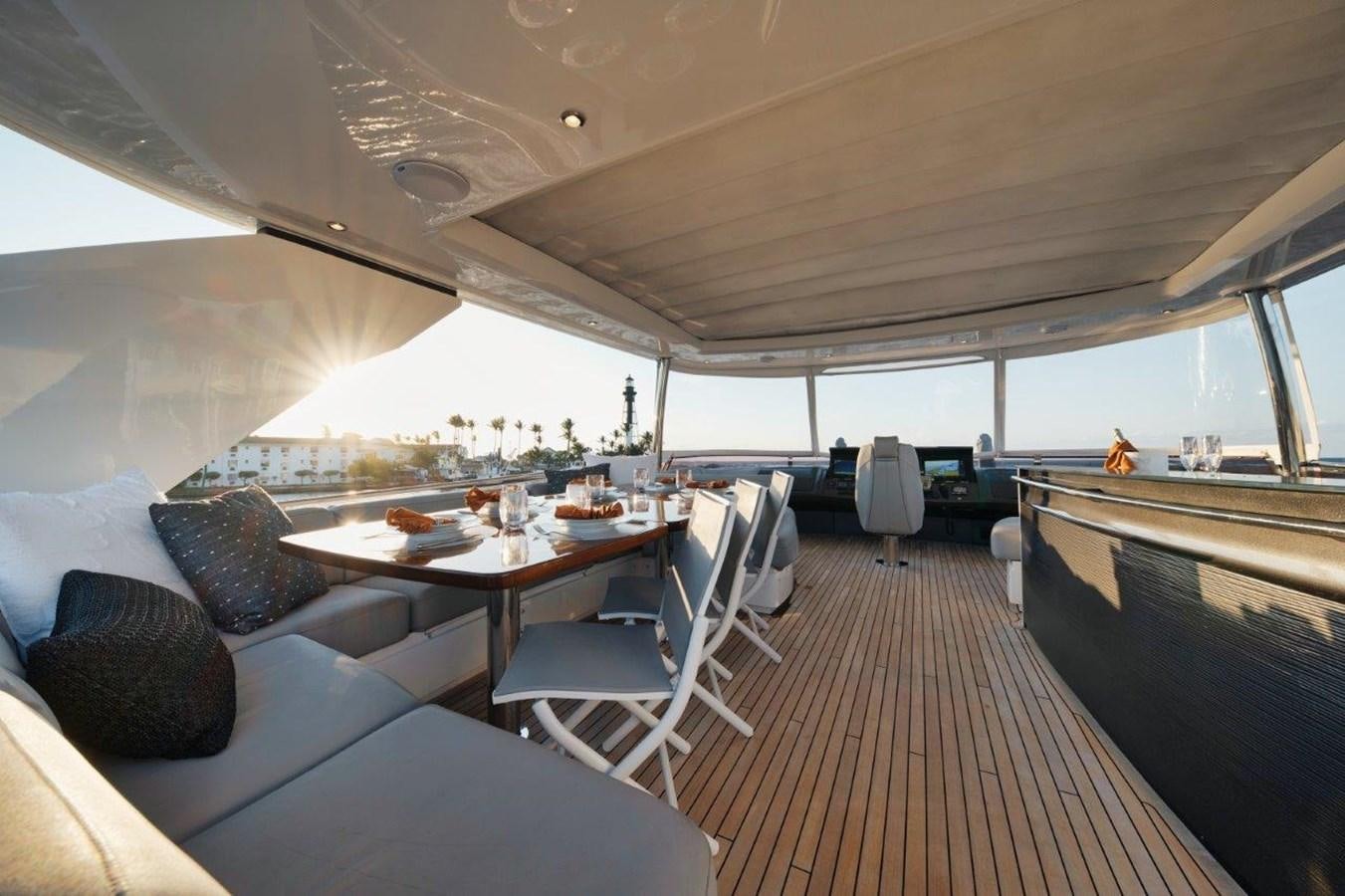 a boat with a table and chairs aboard PRONTO Yacht for Sale