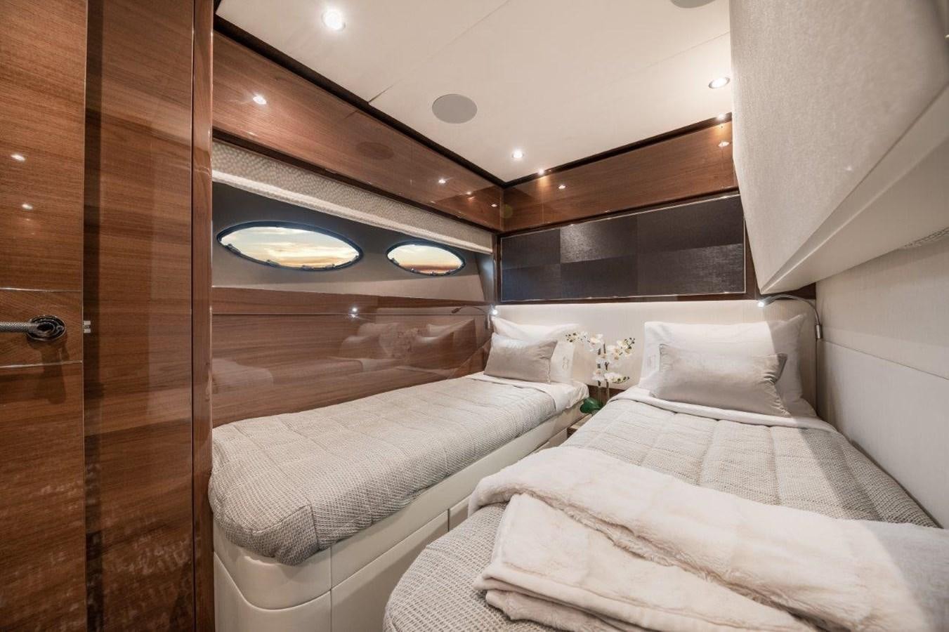 a room with a bed and a mirror aboard PRONTO Yacht for Sale