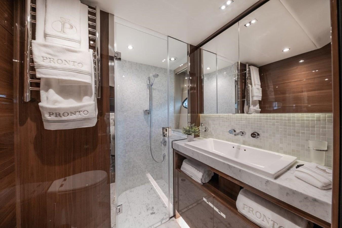 a bathroom with a large mirror aboard PRONTO Yacht for Sale