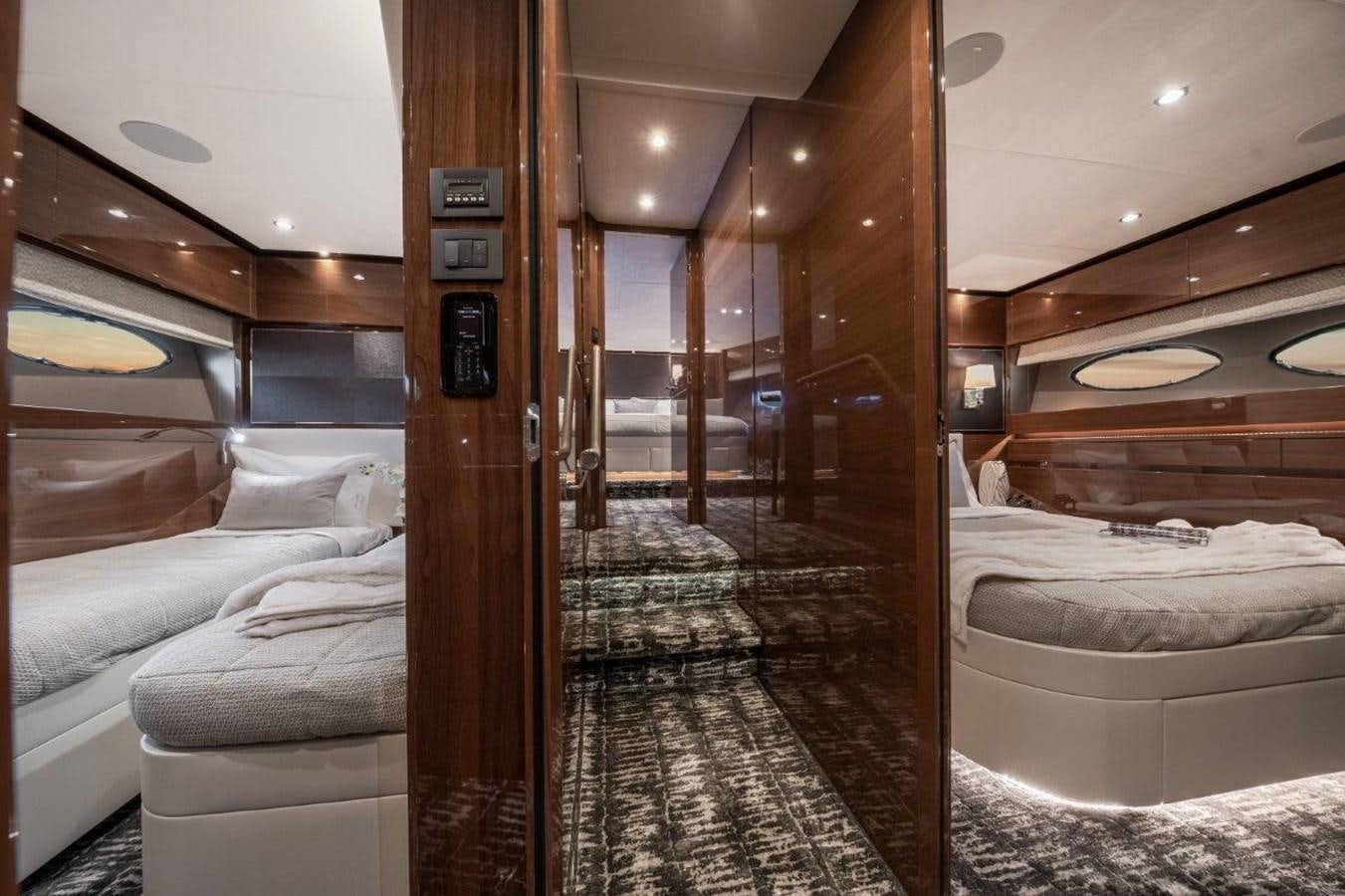 a room with a bed and a mirror aboard PRONTO Yacht for Sale