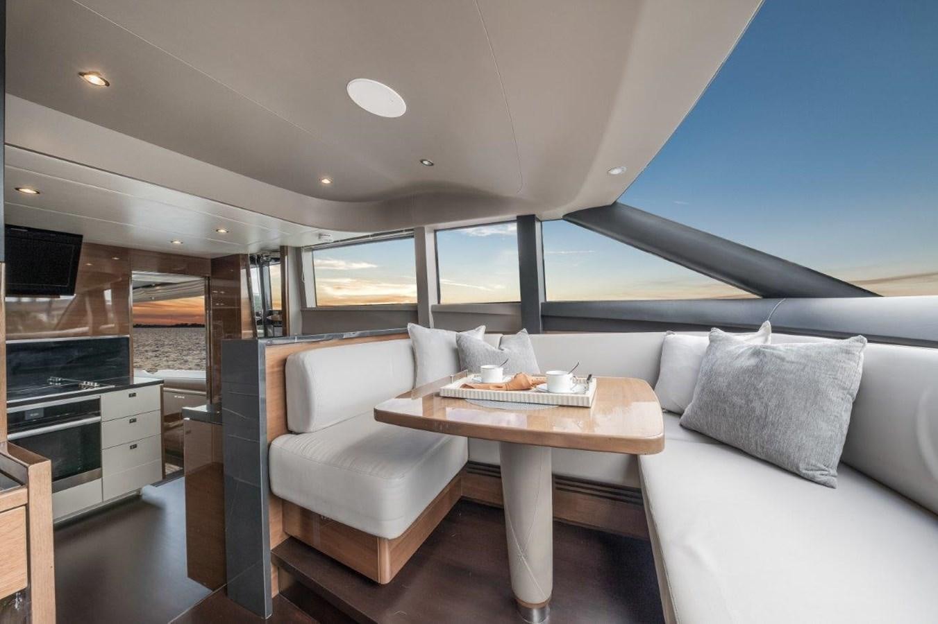 a living room with a couch and a table aboard PRONTO Yacht for Sale