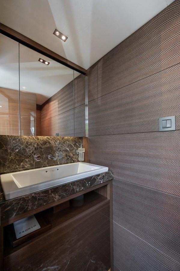 a bathroom with a marble counter aboard PRONTO Yacht for Sale