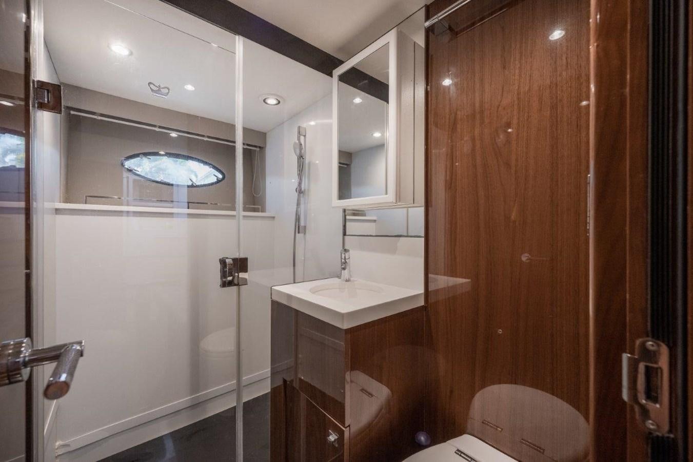 a bathroom with a large mirror aboard PRONTO Yacht for Sale