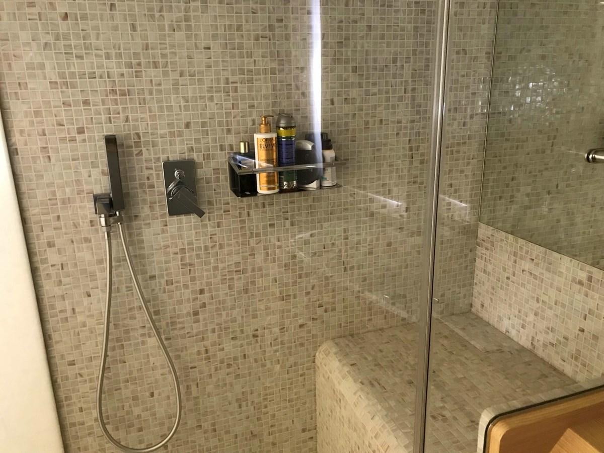 a shower with a glass door aboard 2014 PERSHING 82 Yacht for Sale