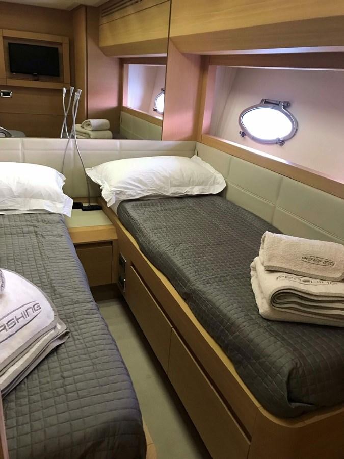 a room with two beds aboard 2014 PERSHING 82 Yacht for Sale