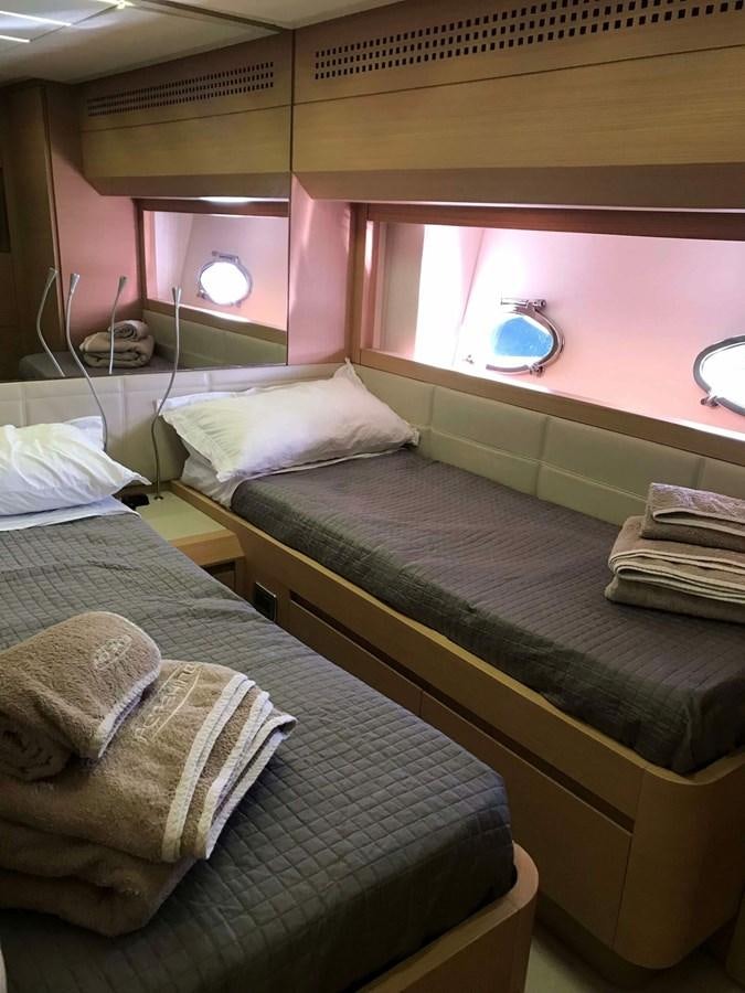 a couple of beds in a room aboard 2014 PERSHING 82 Yacht for Sale