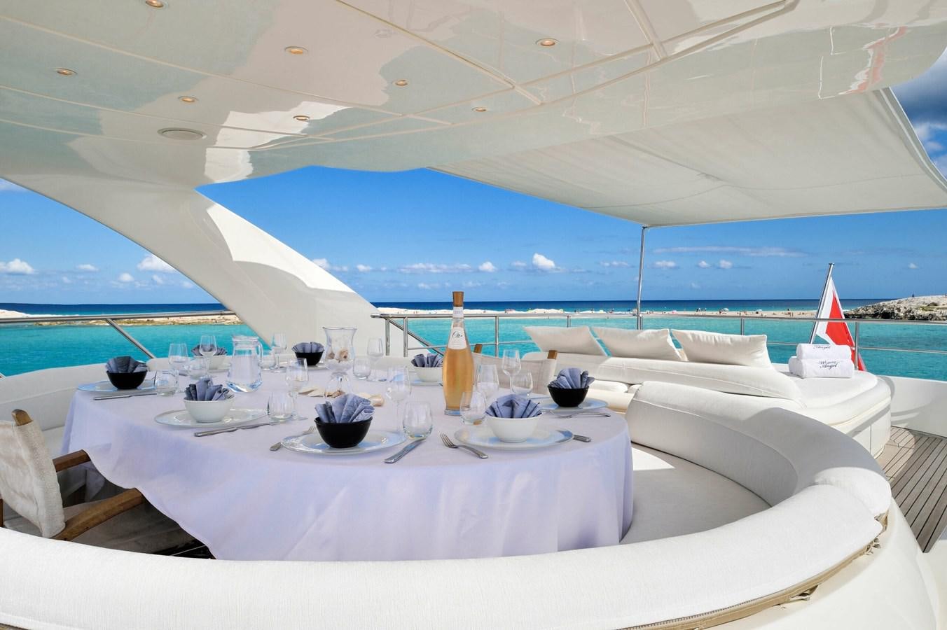 a table set for a dinner aboard WHISPERING ANGEL Yacht for Sale