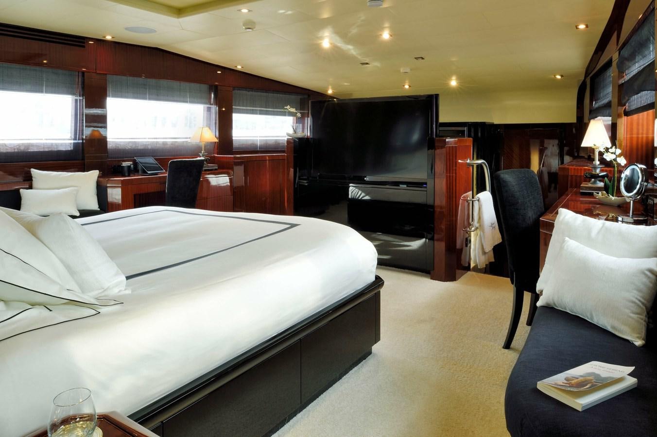 a room with a bed and a tv aboard WHISPERING ANGEL Yacht for Sale