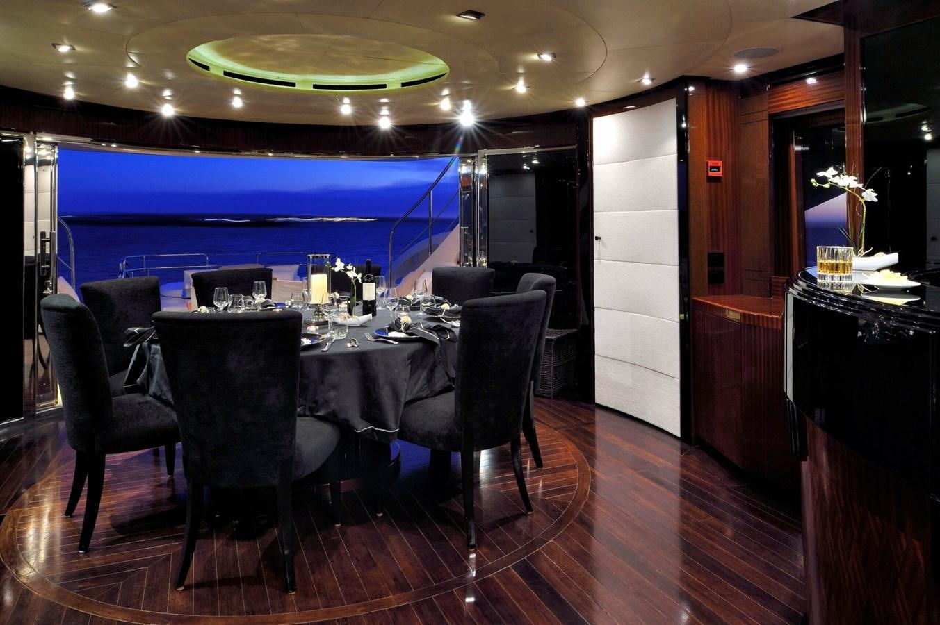 a large room with a table and chairs aboard WHISPERING ANGEL Yacht for Sale