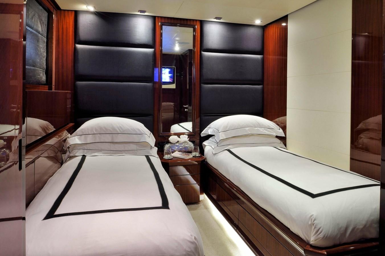 a room with two beds aboard WHISPERING ANGEL Yacht for Sale