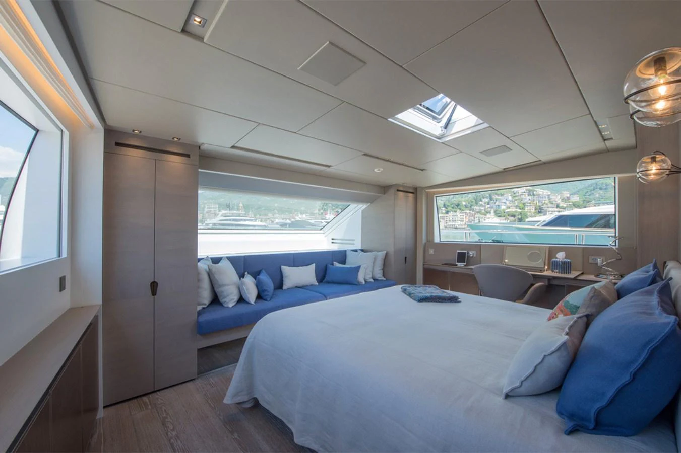 a room with a bed and a window aboard 2016 SANLORENZO SL106 #625 Yacht for Sale