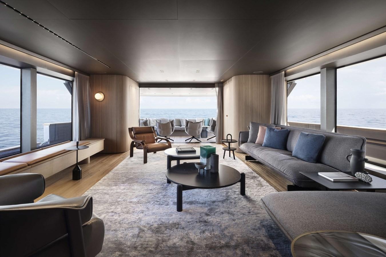 a living room with a couch and a table aboard DA MOON Yacht for Sale