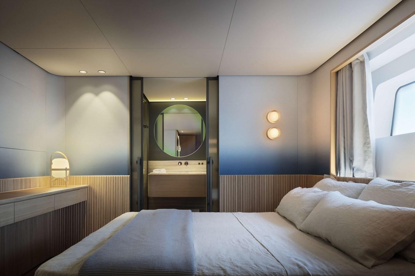 a bed with a blue sheet aboard DA MOON Yacht for Sale