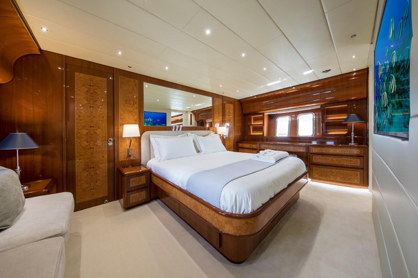 a large bedroom with a large bed aboard CITA Yacht for Sale